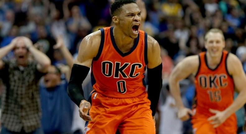 Russell Westbrook of the Oklahoma City Thunder celebrates after scoring a game-winning three-pointer at the buzzer against the Denver Nuggets, at Pepsi Center in Denver, Colorado, on April 9, 2017