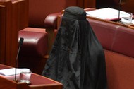 One Nation Leader Senator Pauline Hanson wears a full burqa at Parliament House in Canberra