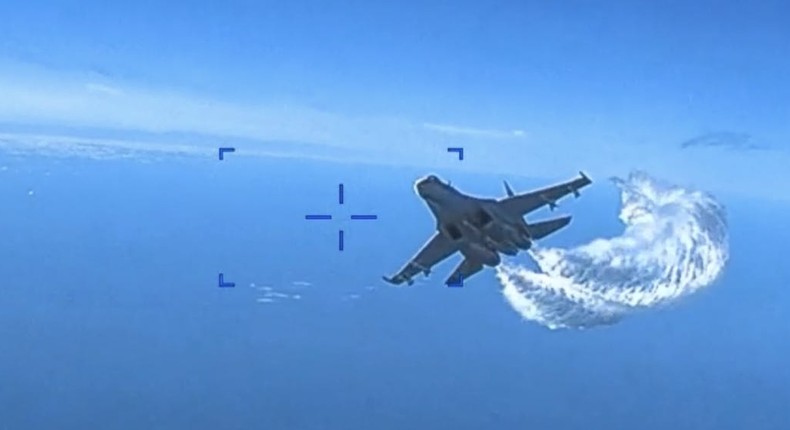 A Russian Su-27 fighter jet approaches a US military MQ-9 Reaper drone operating above the Black Sea on March 14, 2023.Screengrab/US Air Force video