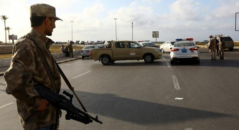 Forces loyal to Libya's Government of National Accord man a checkpoint in the Hay al-Andalus neighbourhood of Tripoli in March 2017