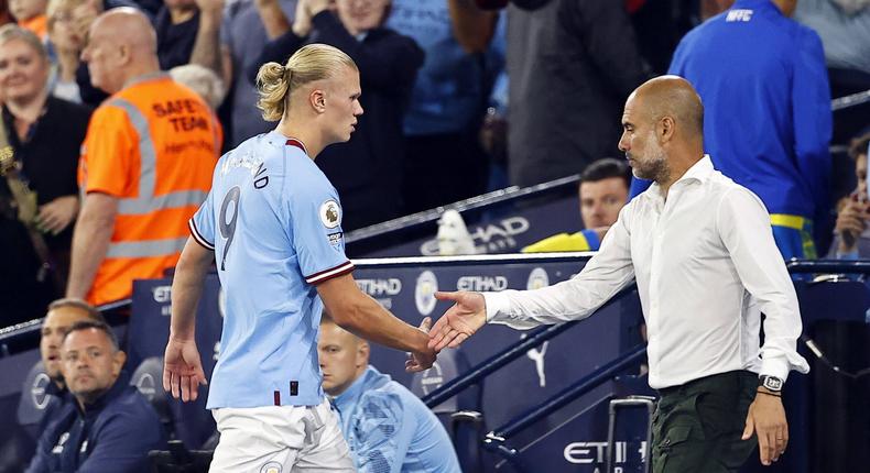Manchester City manager Pep Guardiola brings off Erling Haaland of Manchester City in the second after his second home hat trick in just four days, at the Etihad on August 31, 2022.