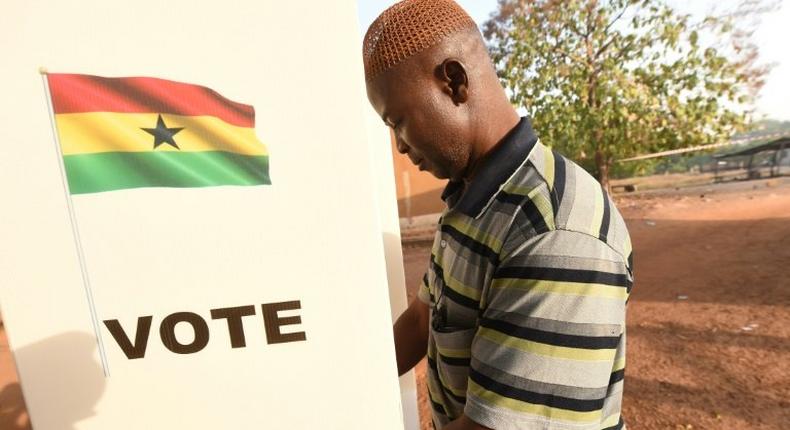 A man casts his vote in the presidential election in Bole district, northern Ghana, on December 7, 2016