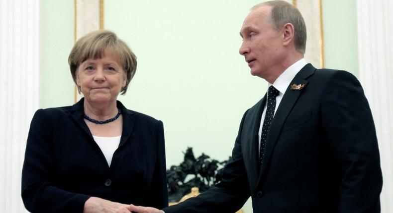 German Chancellor Angela Merkel will meet President Vladimir Putin (shown in this file photo from May 10, 2015 in Moscow) on Tuesday in her first visit to Russia since 2015 in a sign of renewed dialogue between Berlin and Moscow