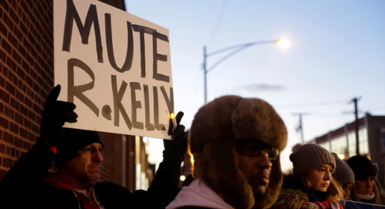 Many protesters positioned themselves in front of Sony Music’s New York City headquarters on Wednesday to ask the label to drop R. Kelly. [Joshua Lott/Reuters]