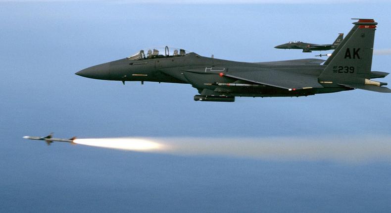 Two F-15E fighter jets fire AIM-7M missiles during a training mission off the coast of Florida, November 5, 2002.