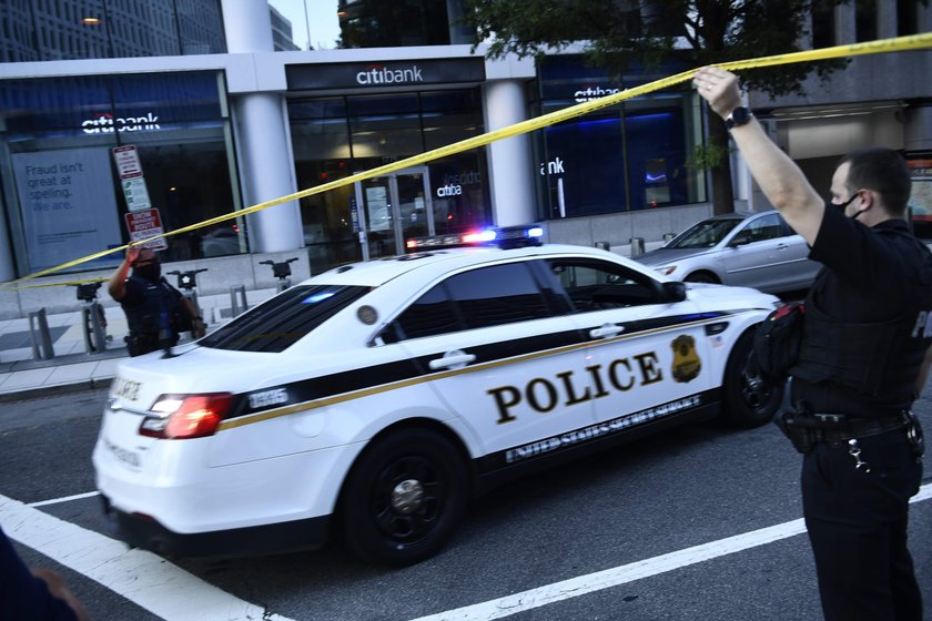 Police officers stop a suspect after a shooting incident outside of the White House, in Washington