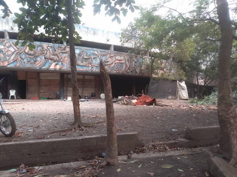 A section of the hotel now occupied by a group of Hausa family with their bathroom erected at the entrance of the hotel. (Pulse)