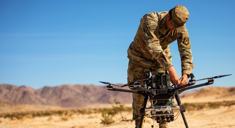 Army Capt. Eric Tatum assigned to the Army Futures Command's Artificial Intelligence Integration Center, conducts field testing with the Inspired Flight 3 Drone during Project Convergence 2022 at Fort Irwin, Calif., Oct. 27, 2022.Army Sgt. Woodlyne Escarne