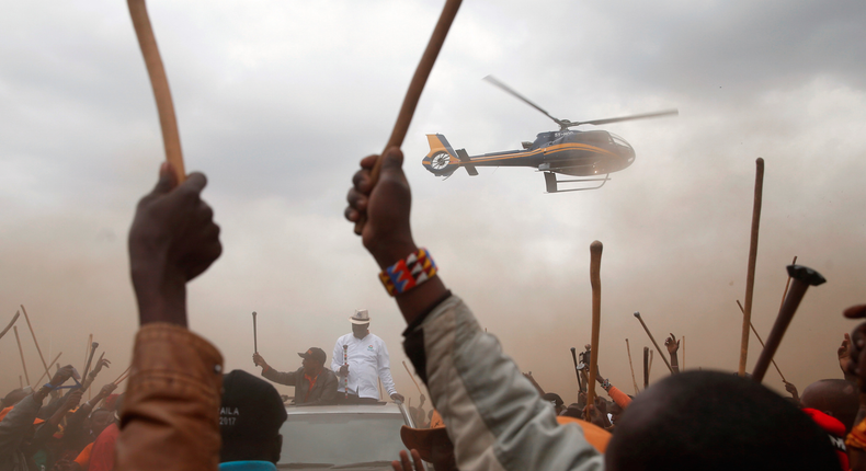 Kenyan opposition leader Raila Odinga, the presidential candidate of the National Super Alliance party, was surrounded by supporters from the Maasai community as he arrived by car to an election rally in Suswa, Kenya.