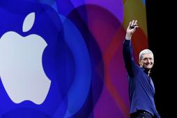 Apple CEO Tim Cook waves as he arrives on stage to deliver his keynote address at the Worldwide Developers Conference in San Francisco