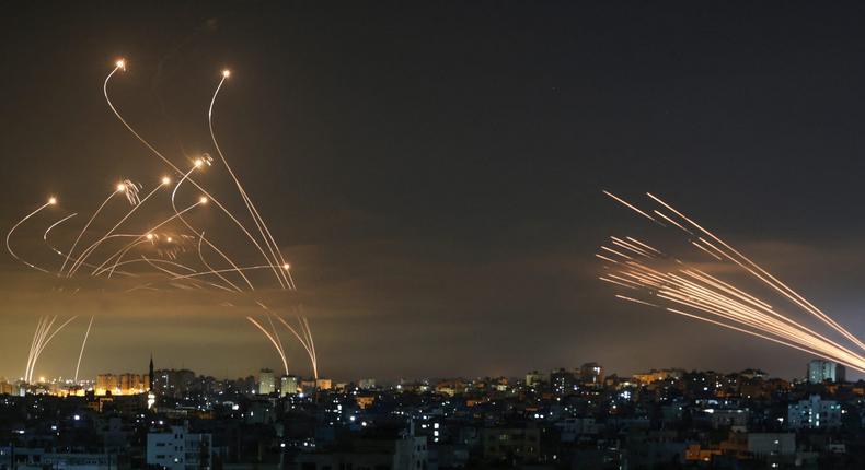 Israel's Iron Dome interceptors seen on the left as rockets are launched from Beit Lahia, northern Gaza, on May 14, 2021.Anas Baba/AFP via Getty Images