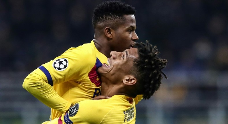 Seventeen-year-old Barcelona forward Ansu Fati (Top) celebrates after becoming the youngest player to score in the Champions League.