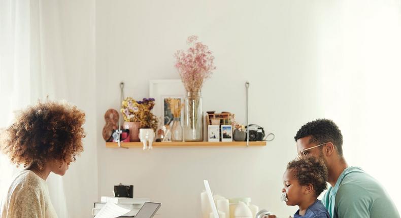 parents working at home with baby