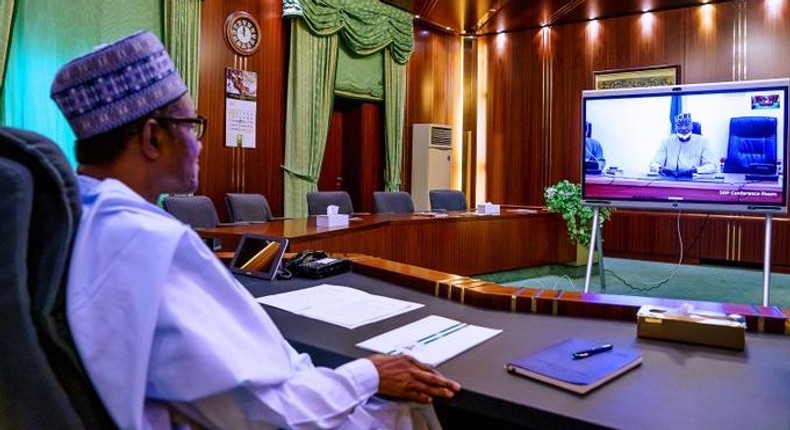 President Muhammadu Buhari receiving updates from the Presidential Task Force on Coronavirus va teleconferencing. [Twitter/@BashirAhmaad]