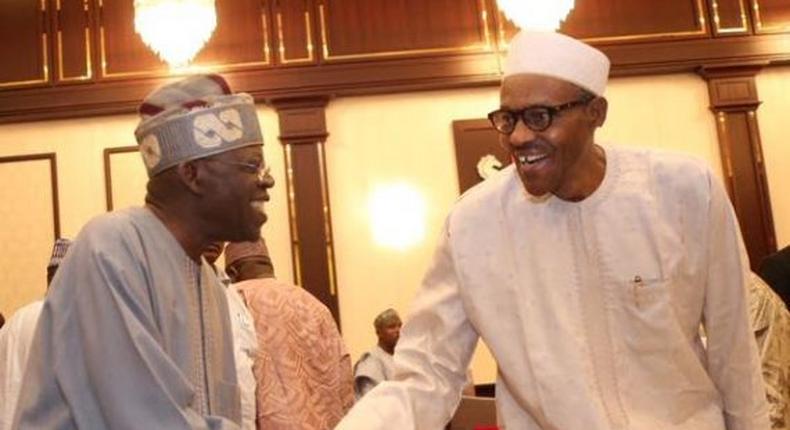 President Buhari and Bola Tinubu exchange pleasantries at the Villa on July 14, where the President hosted APC members.