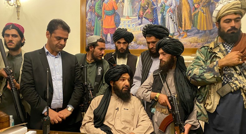 Taliban fighters in the Afghan presidential palace, Kabul, after President Ashraf Ghani fled the country.
