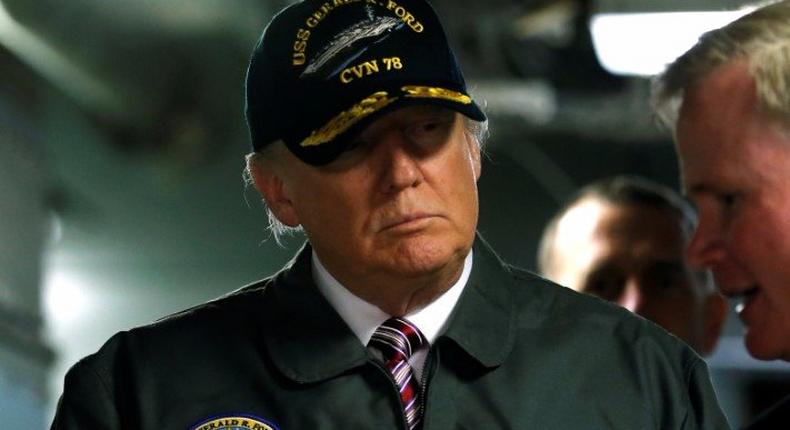 U.S. President Donald Trump tours the pre-commissioned U.S. Navy aircraft carrier Gerald R. Ford with Commanding Officer U.S. Navy Captain Rick McCormack (R) at Huntington Ingalls Newport News Shipbuilding facilities in Newport News, Virginia, Virginia, U.S. March 2, 2017. REUTERS/Jonathan Ernst 