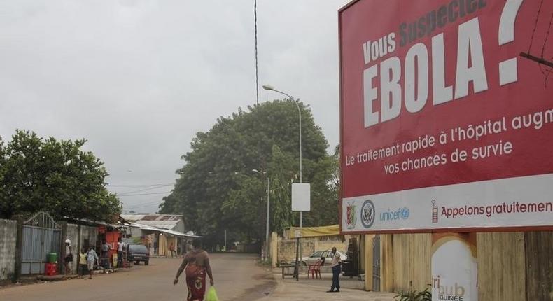 A billboard with a message about Ebola is seen on a street in Conakry, Guinea in this October 26, 2014 file photo. REUTERS/Michelle Nichols