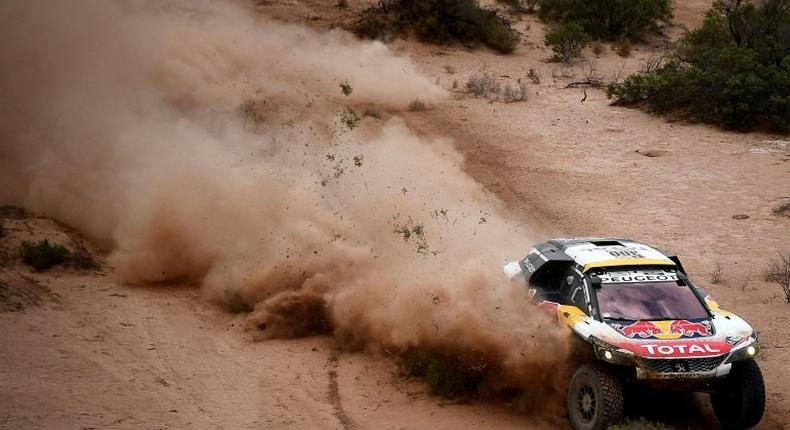 Peugeot's driver Stephane Peterhansel and co-driver Jean Paul Cottret compete during Stage 11 of the 2017 Dakar Rally between San Juan and Rio Cuarto, in Argentina, on January 13, 2017