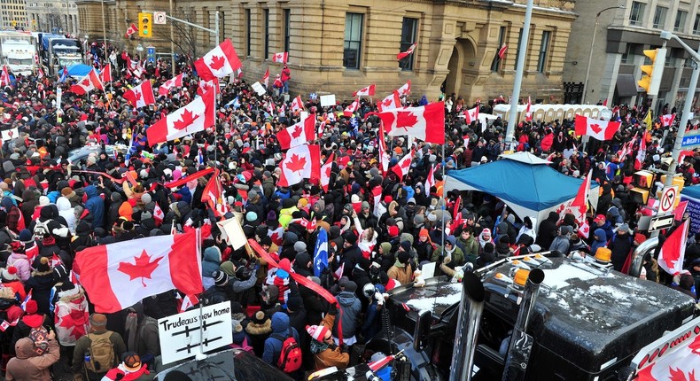 Supporters and truckers in front of Parliament Hill during a protest in downtown of Ottawa, Canada.