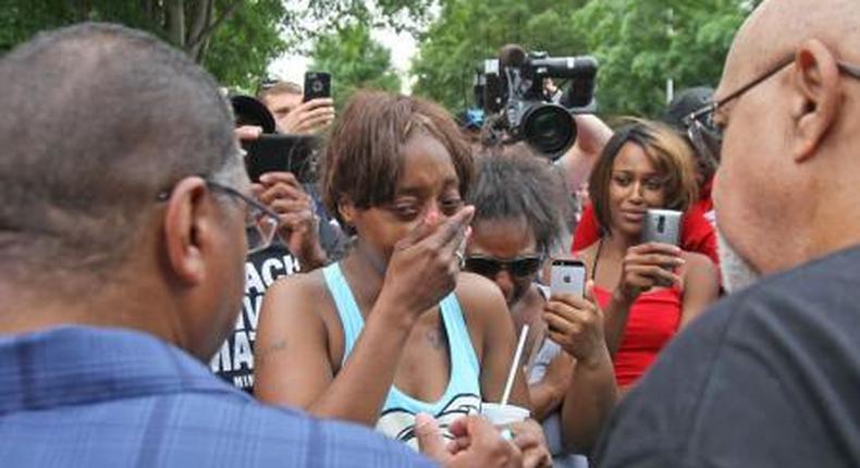 Diamond Reynolds weeps after she recounts the incidents that led to the fatal shooting of her boyfriend Philando Castile by Minneapolis area police during a traffic stop on Wednesday, at a Black Lives Matter demonstration, in front of the Governors Mansion in St. Paul, Minnesota, U.S., July 7, 2016.