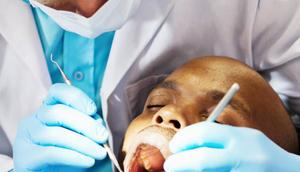 A patient being examined by a dentist