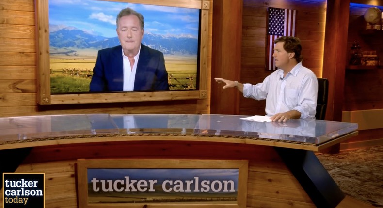 The Fox News host Tucker Carlson interviewing the British TV personality Piers Morgan.
