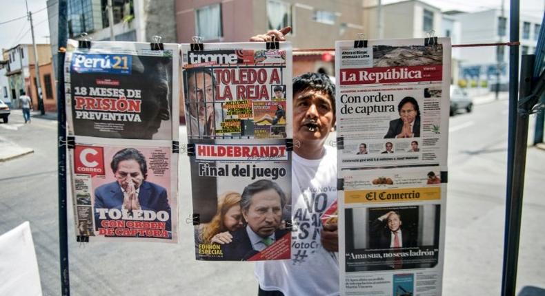 Newspapers with the portrait of former Peruvian President (2001-2006) Alejandro Toledo on their front pages, are displayed for sale in Lima on February 10, 2017