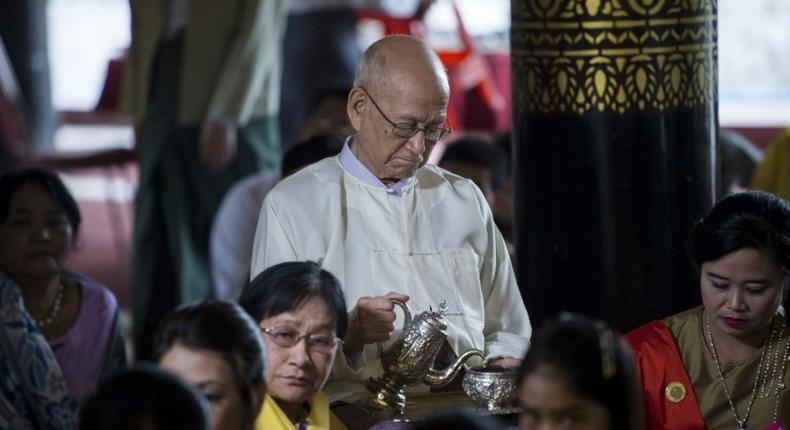 Taw Phaya (C), 93, grandson of King Thibaw, attends a ceremony with relatives at Mandalay's Golden Palace on November 22, 2016 to mark the exile anniversary of their royal ancestor