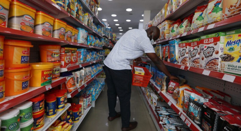 A man wearing a protective mask shops for groceries at a supermarket in Abuja amid the coronavirus outbreak, in Abuja.