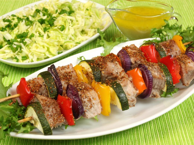 9305_stock-photo-shish-kebab-delicious-meat-cuisine-with-zucchini-onions-and-peppers-salad-in-background--shutterstock_55179898