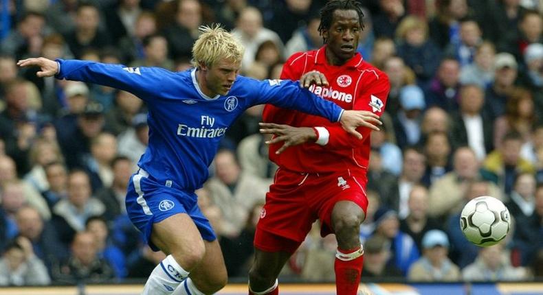 Chelsea's Eidur Gudjohnsen vies for the ball with Middlesbrough's captain Ugo Ehiogu (right) during their Premiership match in April 2004 at Stamford Bridge in London