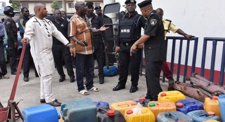 The Commander of the Rapid Response Squad (RRS), ACP. Tunji Disu  as well as the Divisional Police Officer, Isheri Police Station, Superintendent Olohunwa Ogundele, arresting a petrol station manager