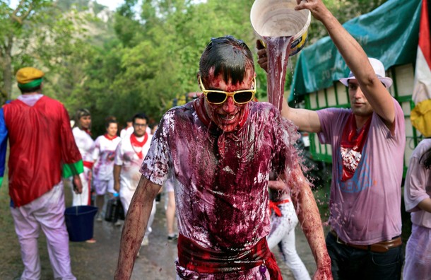 A reveller has wine poured over him during the Batalla de Vino (Wine Battle) in Haro