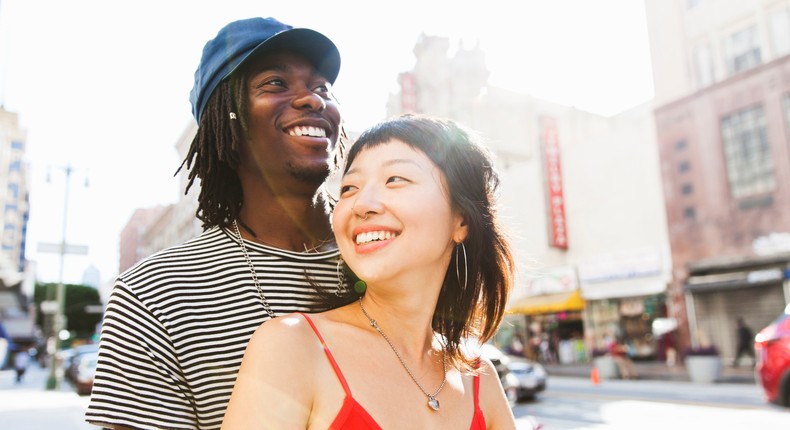 A young couple in a city street.Stephen Zeigler/Getty Images