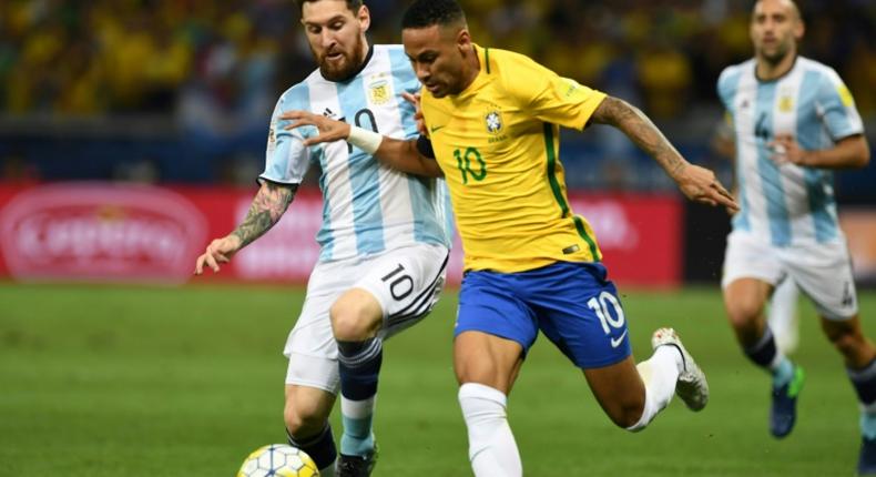 Argentina's Lionel Messi (left) and Brazil's Neymar challenge for the ball in a World Cup qualifier in 2016