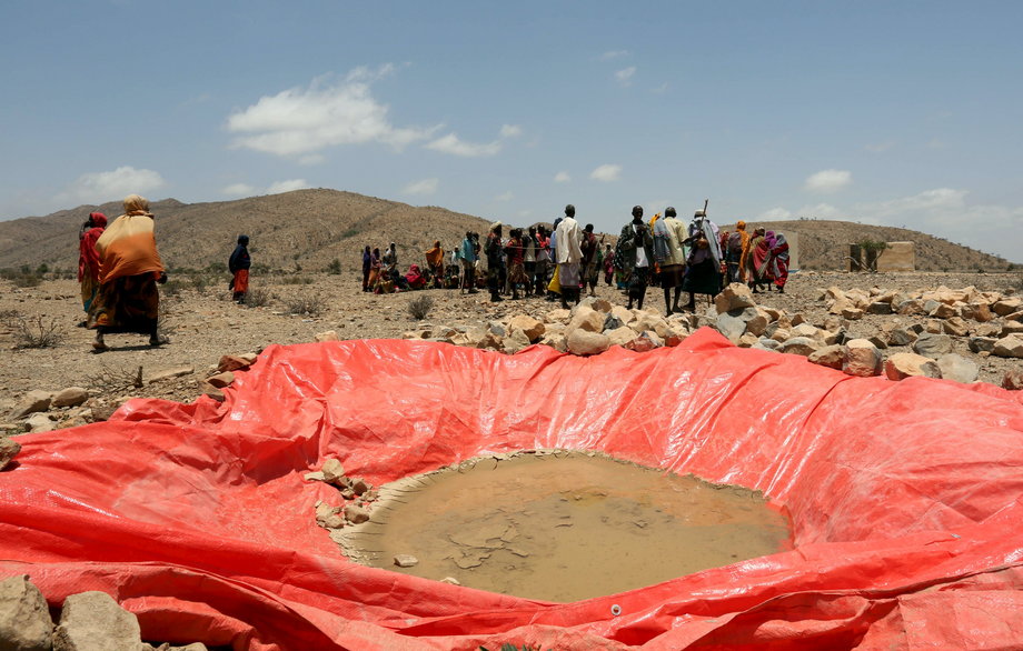 Displaced people gather at an artificial water pan near Habaas town of Awdal region.