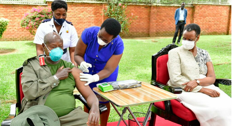 President Museveni and First Lady, Janet Museveni, get vaccinated by the Permanent Secretary Ministry of Health, Diana Atwine, at State House
