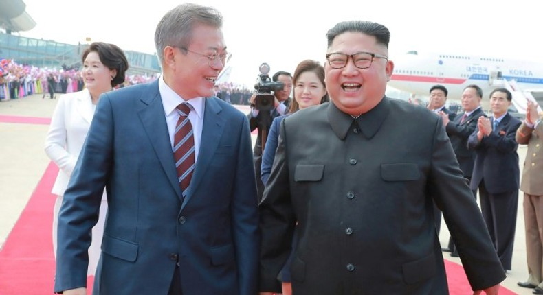 North Korean leader Kim Jong Un (R) will visit Seoul 'soon', according to the South's President Moon Jae-in (L)