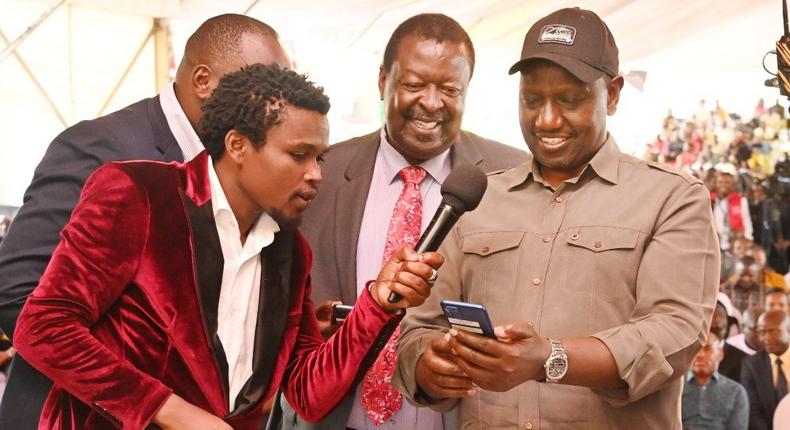 President William Ruto, Prime Cabinet Secretary Musalia Mudavadi and comedian Chipukeezy during the launch of Hustler Fund in Nairobi on November 30, 2022