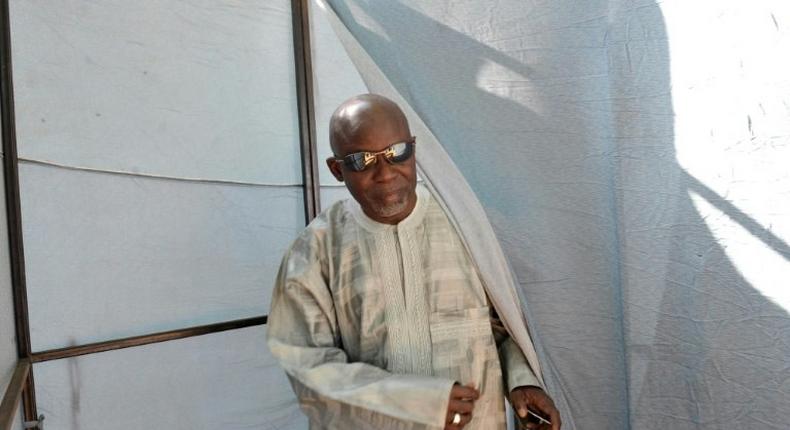 Gambian opposition leader Ousainou Darboe leaves a polling station during the 2011 presidential election