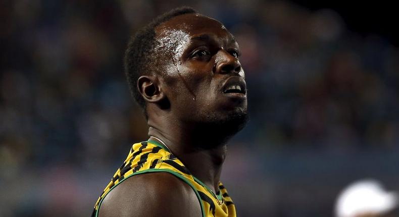 Usain Bolt of Jamaica reacts after Jamaica placed second behind the U.S. in the 4x100 meters race at the IAAF World Relays Championships in Nassau, Bahamas, May 2, 2015. Japan placed third. 