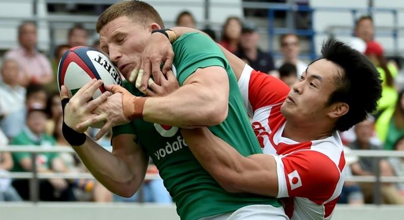 Japan left-wing Kenki Fukuoka (R) tackles Ireland fullback Andrew Conway during the second Test in Tokyo on June 24, 2017