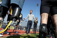 Britain's Prince Harry Patron of the Invictus Games Foundation, speaks to competitors as he attends 