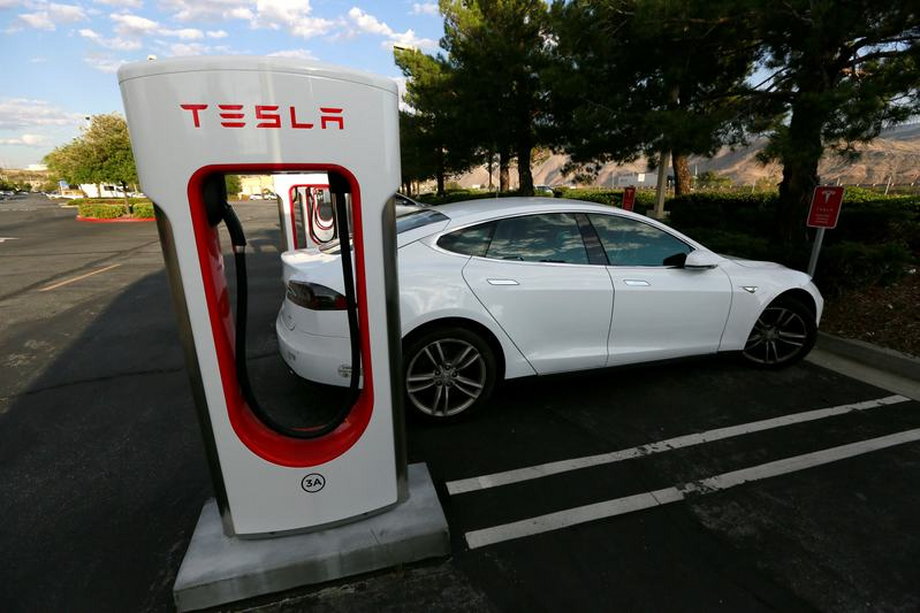 A Tesla Model S charges at a Tesla Supercharger station.