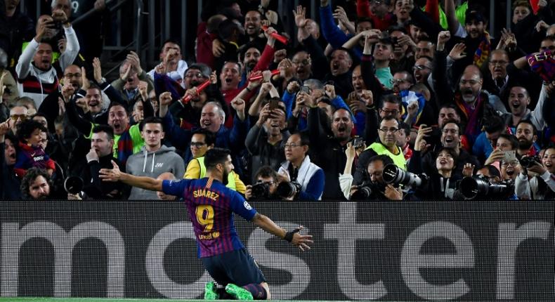 Luis Suarez celebrates scoring Barcelona's first goal against Liverpool on Wednesday.