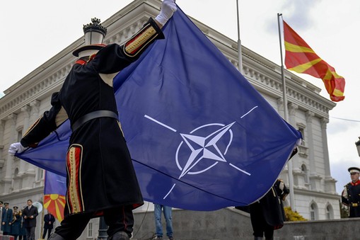 NATO flag hoisted alongside Macedonian flag at government building in Skopje