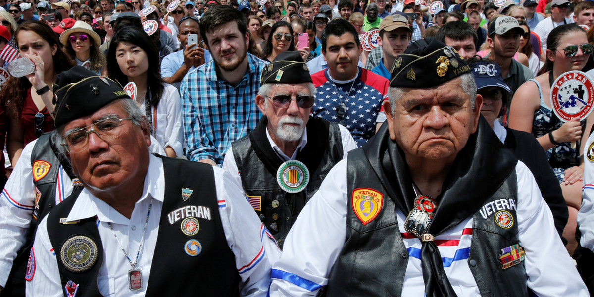 Vietnam war veterans among other guests listen to U.S. President Barack Obama at the Memorial Day observance at Arlington National Cemetery in Washington, U.S., May 30, 2016.
