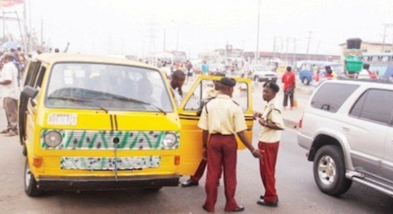 LASTMA officials impounding a commercial bus in Lagos. (Thenation)