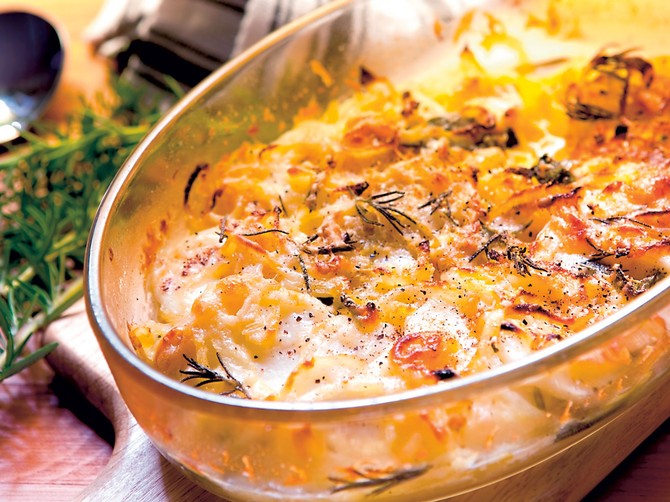 13480_stock-photo-potato-and-onion-gratin-with-rosemary-in-warm-light-shutterstock_64897009